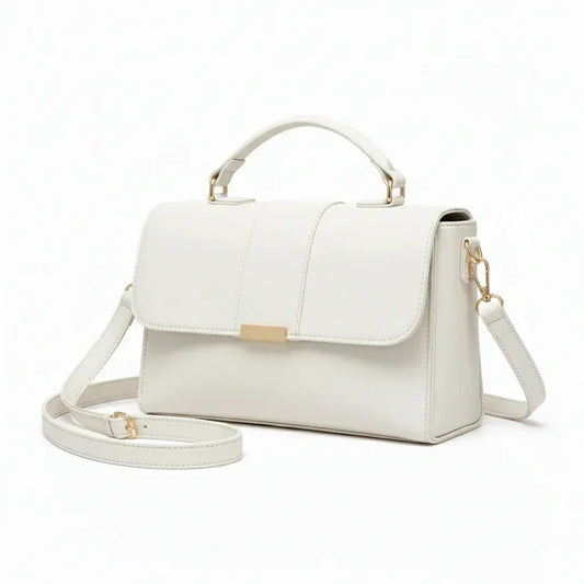 Elegant white leather handbag with top handle, gold-tone hardware, and detachable strap