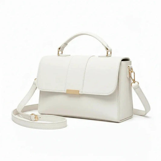 Elegant white leather handbag with top handle, gold-tone hardware, and detachable strap