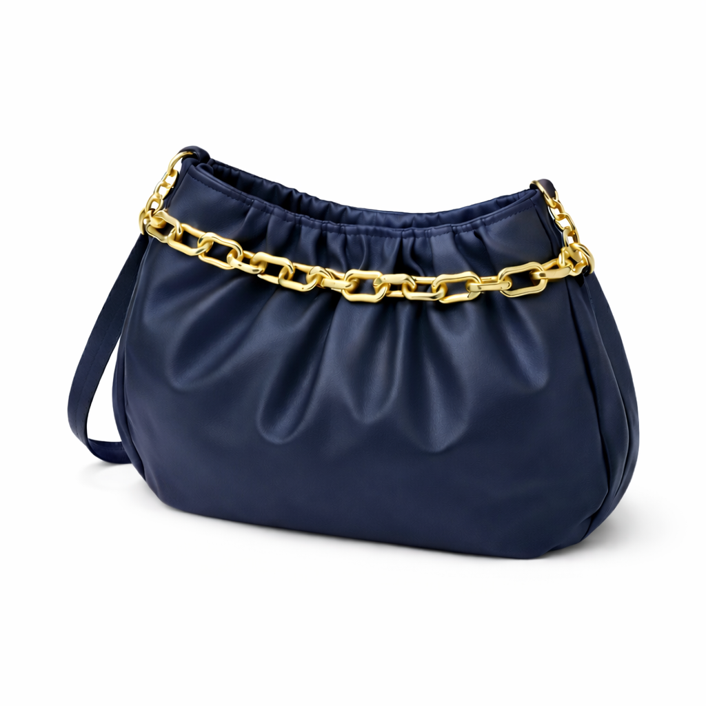 Navy blue handbag with gold chain accent and ruched detailing on a white background
