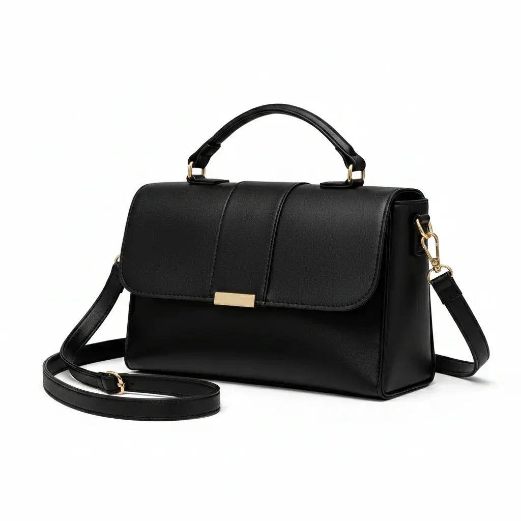 Elegant black leather handbag with gold hardware and adjustable shoulder strap