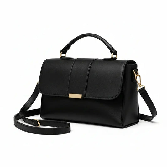 Elegant black leather handbag with gold hardware and adjustable shoulder strap
